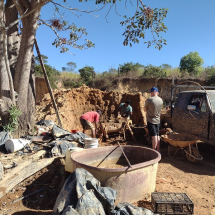 Mixing clay for bricks